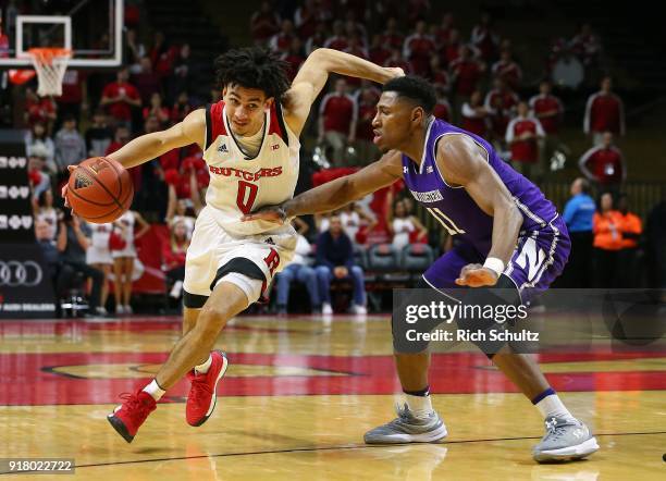 Geo Baker of the Rutgers Scarlet Knights drives to the basket as Anthony Gaines of the Northwestern Wildcats defends during the second half of a game...