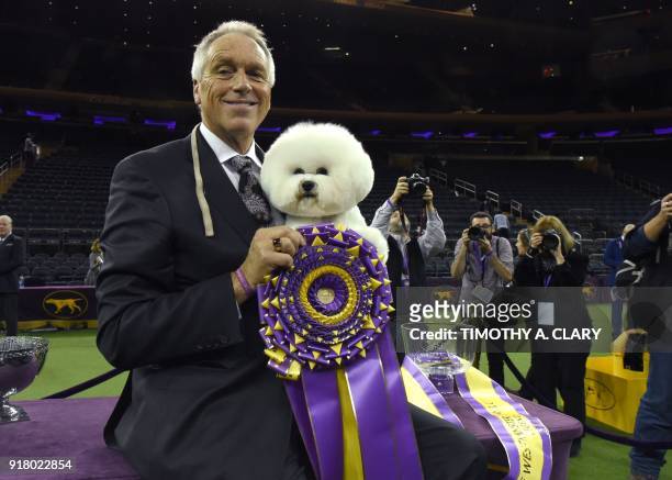 "Flynn" the Bichon Frise, with handler Bill McFadden, poses after it won "Best in Show" at the Westminster Kennel Club 142nd Annual Dog Show in...