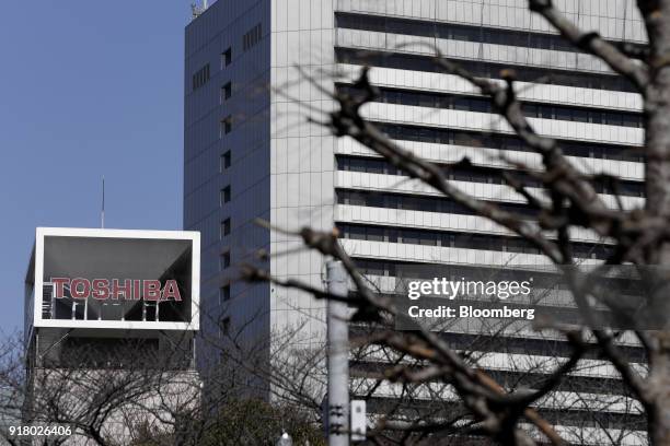 Signage for Toshiba Corp. Is displayed at the company's headquarters in Tokyo, Japan, on Wednesday, Feb. 14, 2018. Toshiba announced Wednesday that...