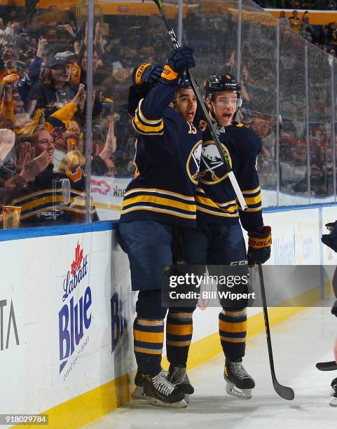 Nicholas Baptiste of the Buffalo Sabres celebrates his first period goal against the Tampa Bay Lightning with Casey Nelson during an NHL game on...