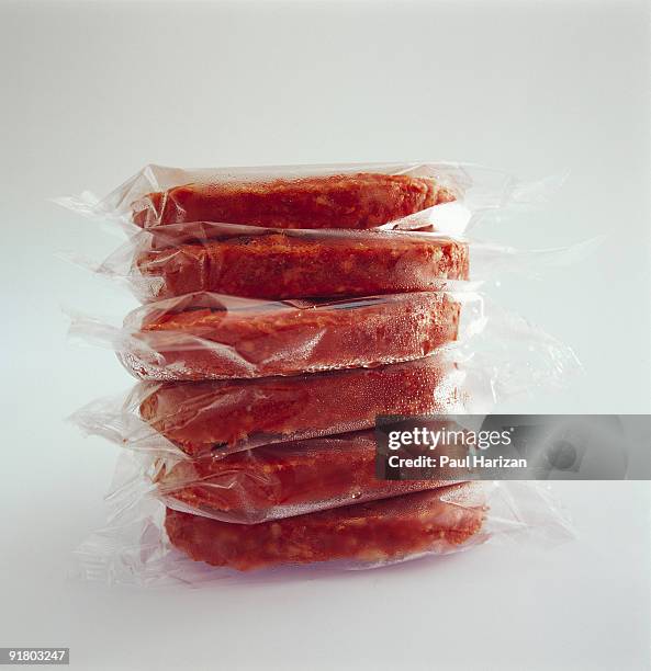 stack of frozen meat - meat packaging imagens e fotografias de stock