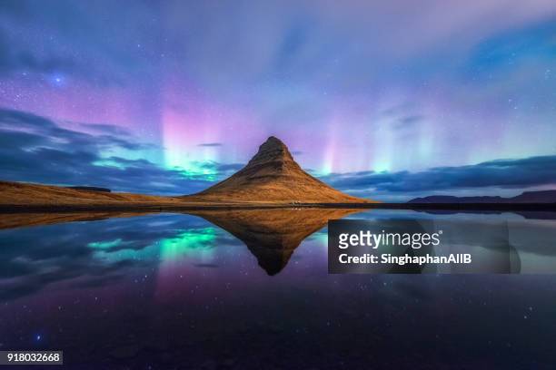 aurora at kirkjufell mountain with reflection - romantic sky stock pictures, royalty-free photos & images