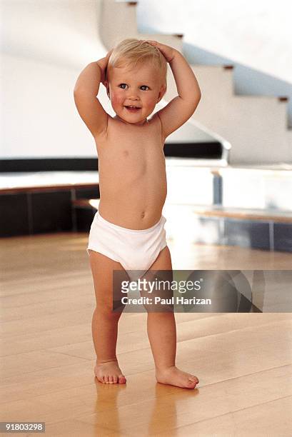baby boy smiling - diapers stockfoto's en -beelden