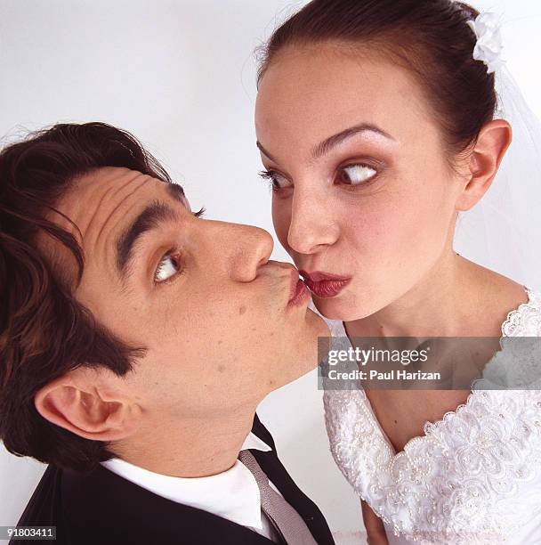 bride and groom kissing - embarrassed girlfriend stock pictures, royalty-free photos & images