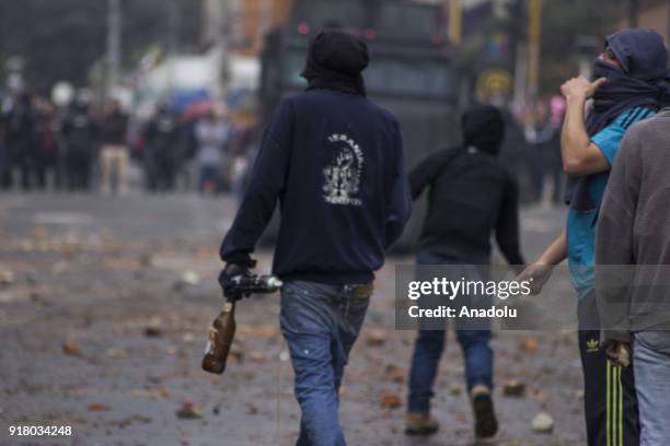 Protester holds a spray can within the clashes that broke out between students and riot police during a protest demanding improvements of the...