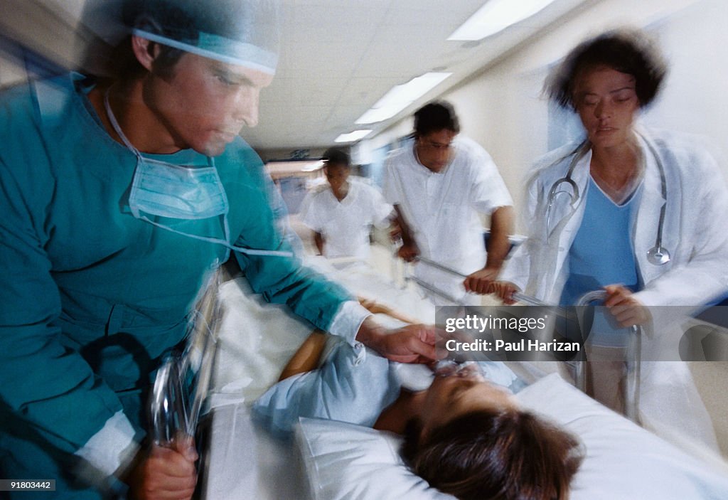 Patient Rushed Hospital Workers Rushing Patient On Gurney High-Res Stock Photo - Getty ...