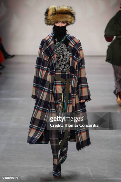 Model walks the runway wearing Vivienne Tam Fall 2018 with makeup by Fawn Monique and Hair by Moroccanoil at Gallery I at Spring Studios on February...