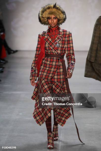 Model walks the runway wearing Vivienne Tam Fall 2018 with makeup by Fawn Monique and Hair by Moroccanoil at Gallery I at Spring Studios on February...