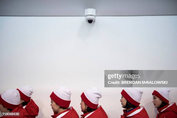 North Korean cheerleaders arrive for a women's preliminary round ice hockey match between Unified Korea and Japan during the Pyeongchang 2018 Winter...