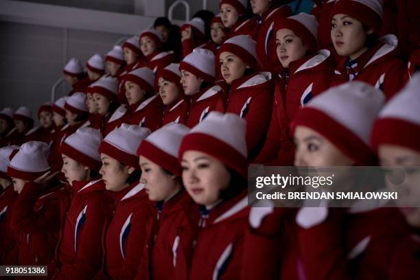 North Korean cheerleaders wait for a women's preliminary round ice hockey match between Unified Korea and Japan during the Pyeongchang 2018 Winter...