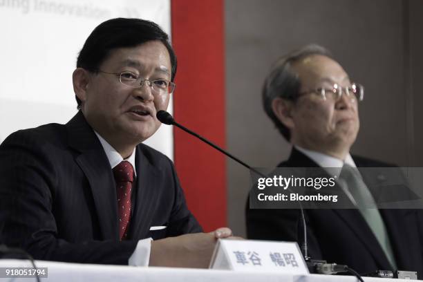 Nobuaki Kurumatani, incoming chief executive officer and chairman of Toshiba Corp., left, speaks while Satoshi Tsunakawa, outgoing chief executive...