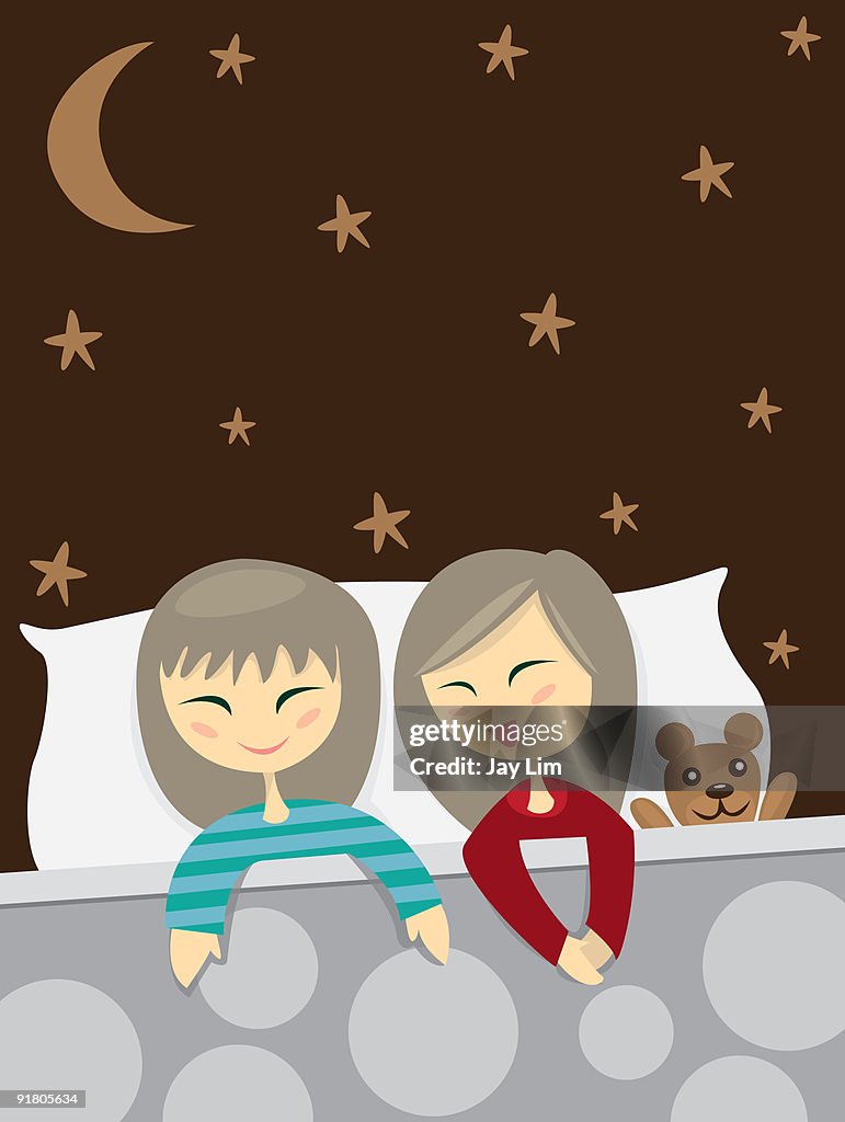Two little girls talking in bed