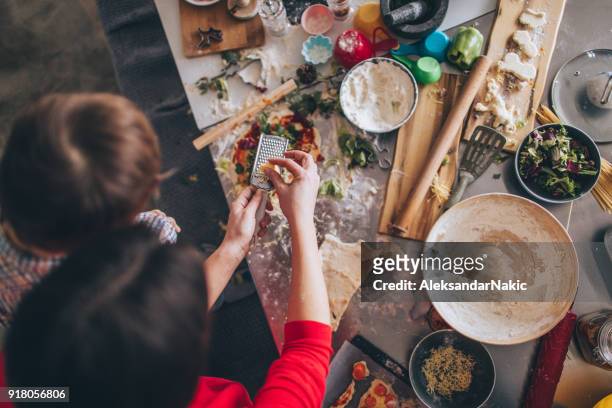 homemade pizza for dinner - messy table stock pictures, royalty-free photos & images