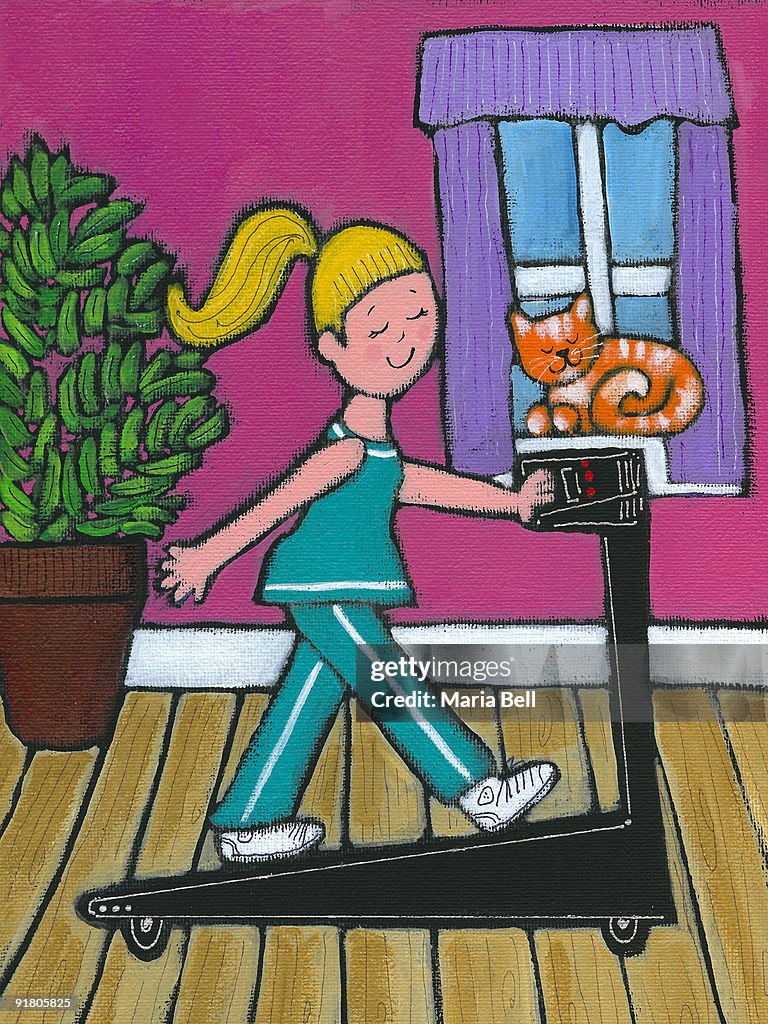 A woman walking on her treadmill
