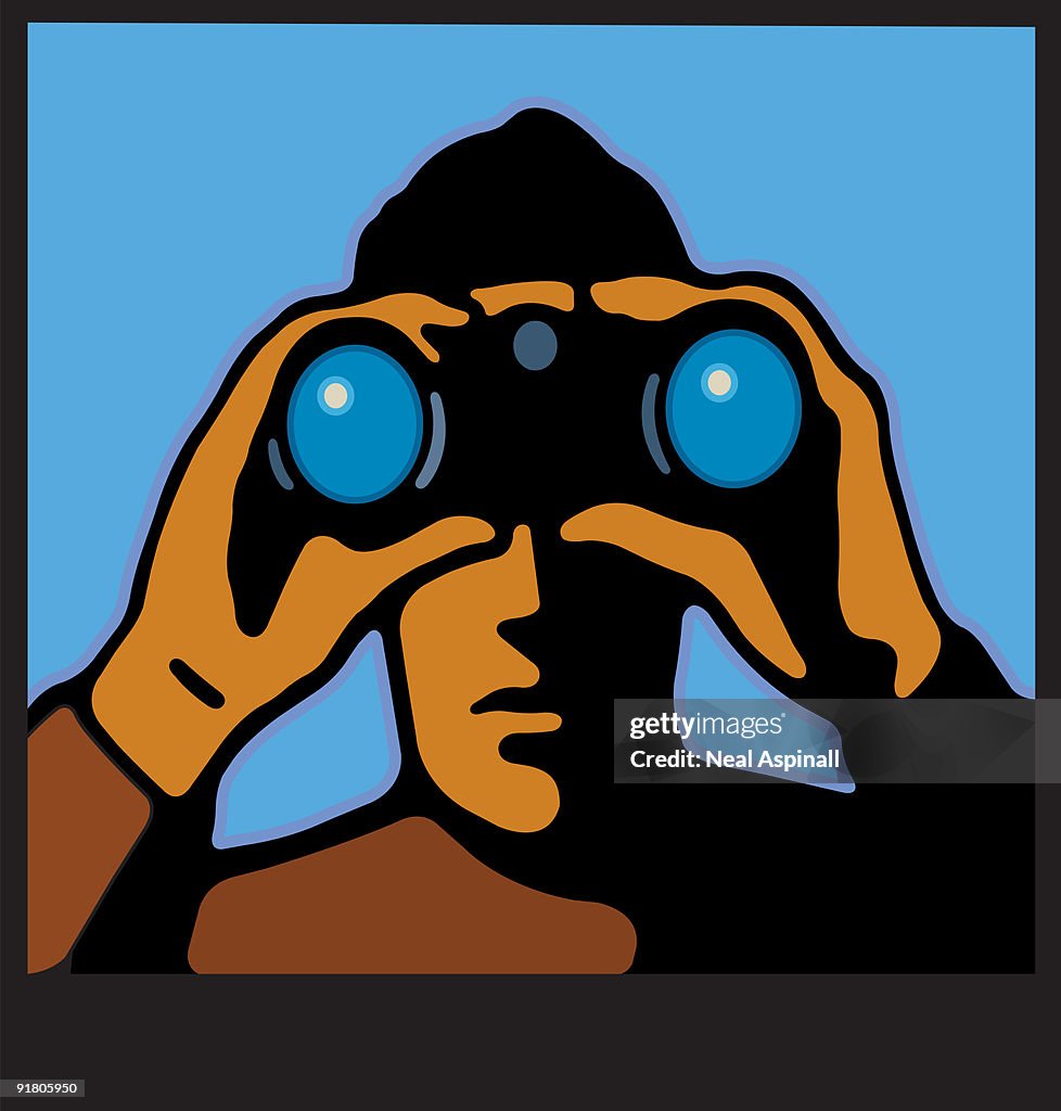 A man using binoculars looking out