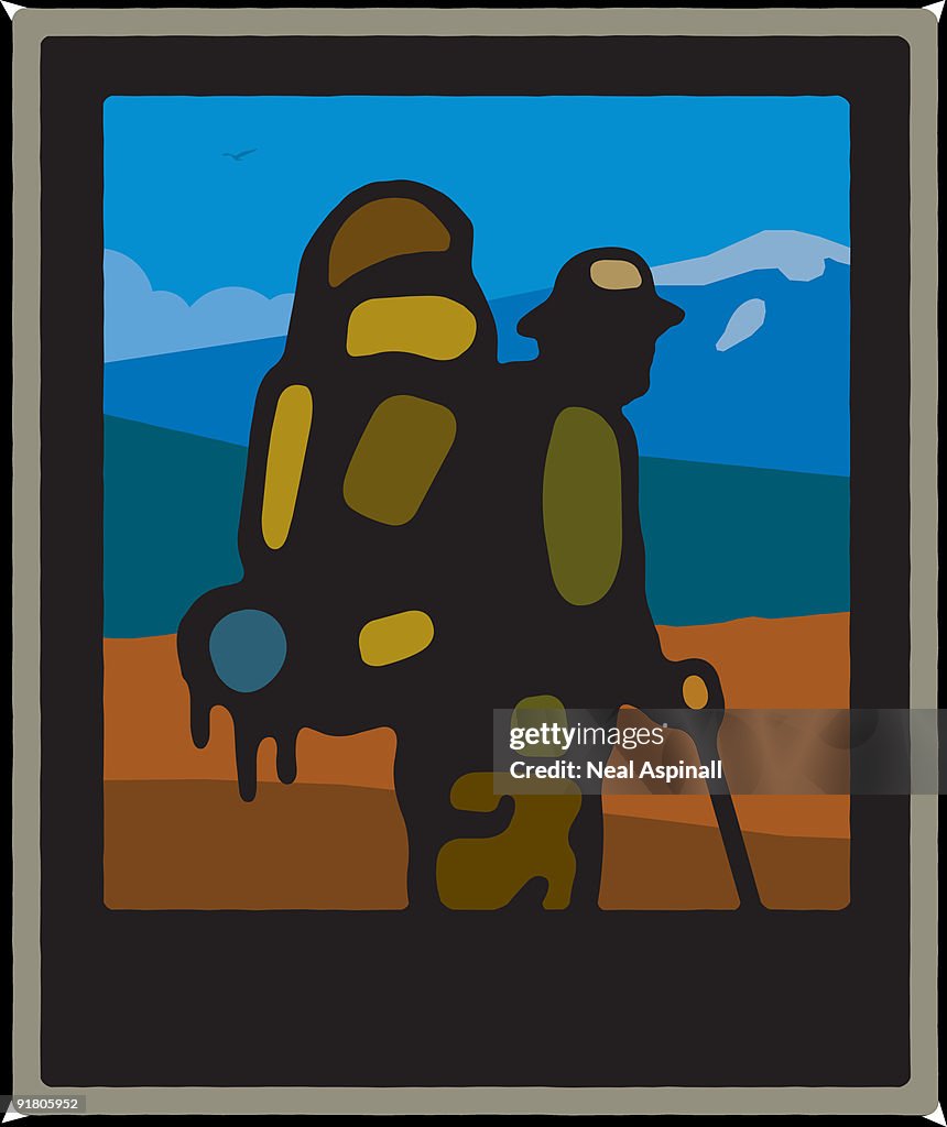A man with a walking stick and back pack