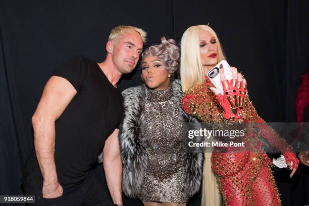 David Blonde, Lil' Kim and Phillippe Blonde pose backstage at The Blonds fashion show during New York Fashion Week: The Shows at Spring Studios on...