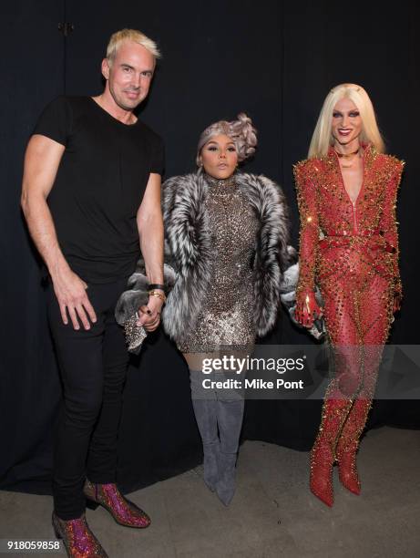 David Blonde, Lil' Kim and Phillippe Blonde pose backstage at The Blonds fashion show during New York Fashion Week: The Shows at Spring Studios on...