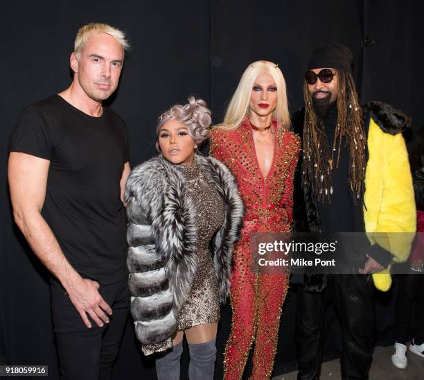 Designer David Blond, Lil' Kim, designer Philip Blond, and stylist Ty Hunter pose backstage at The Blonds fashion show during New York Fashion Week:...