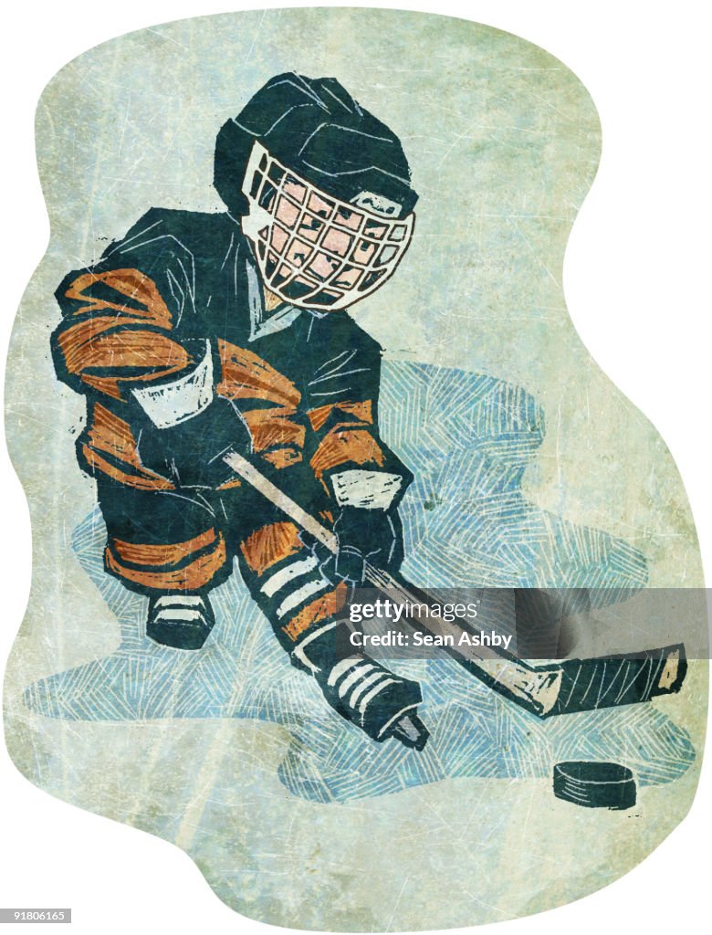 A boy playing ice hockey