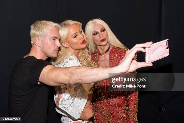 David Blonde, Gigi Gorgeous, and Phillippe Blonde pose for a selfie backstage at The Blonds fashion show during New York Fashion Week: The Shows at...