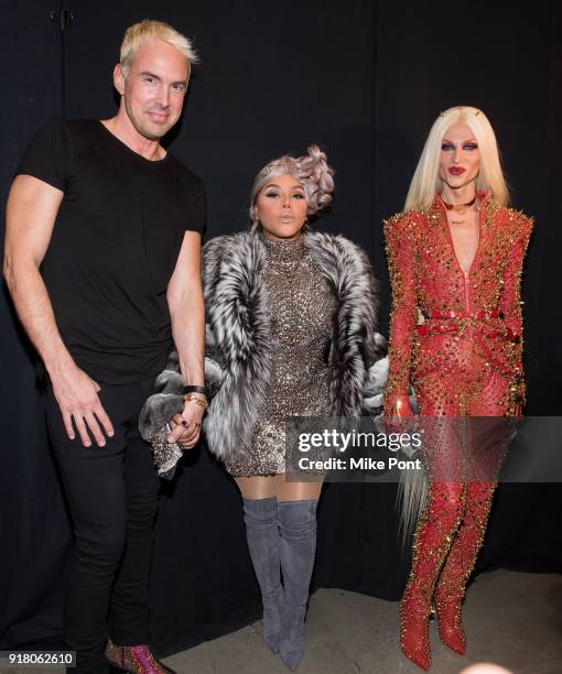 David Blonde, Lil' Kim and Phillippe Blonde pose backstage at The Blonds fashion show during New York Fashion Week: The Shows at Spring Studios on...