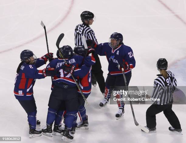 Randi Heesoo Griffin of Korea celebrates after she scored during the Women's Ice Hockey Preliminary Round Group B game between Korea and Japan on day...