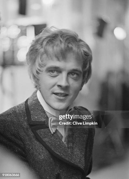 British actor David Hemmings filming a scene for comedy film 'The Best House in London' at the Royal Opera Arcade, London, UK, 10th March 1968.