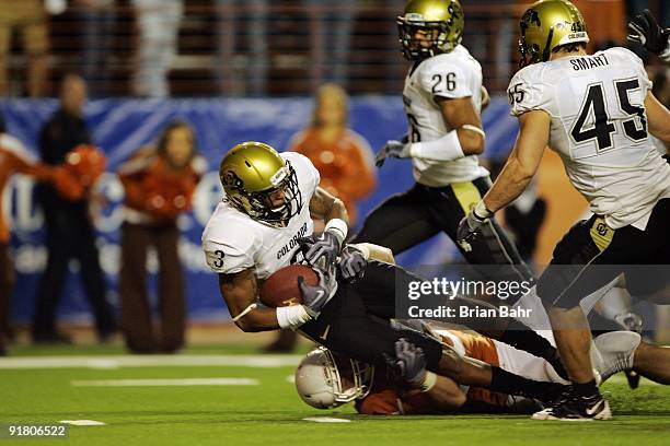 Cornerback Jimmy Smith of the Colorado Buffaloes picks up the loose ball which was knocked out of the hand of quarterback Colt McCoy of the Texas...