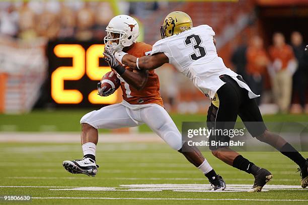 Wide receiver John Chiles of the Texas Longhorns makes a quick cut after catching a pass against cornerback Jimmy Smith of the Colorado Buffaloes in...