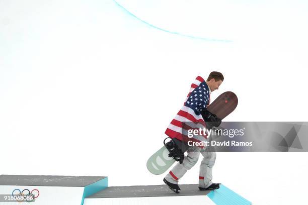 Gold medalist Shaun White of the United States goes down the podium during the victory ceremony for the Snowboard Men's Halfpipe Final on day five of...