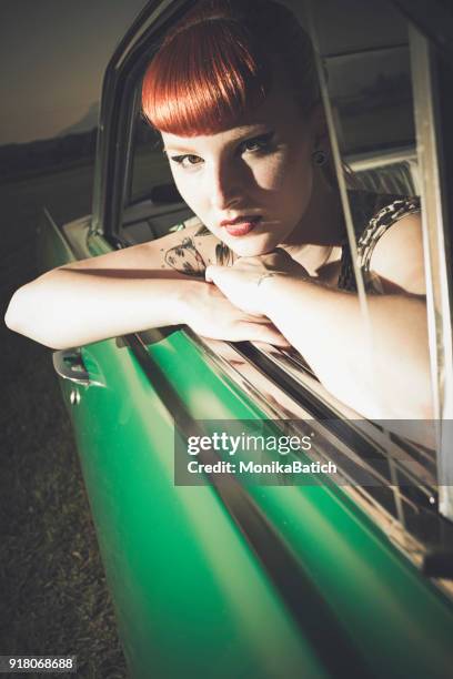 pin-up girl in the car - rockabilly pin up girls stock pictures, royalty-free photos & images