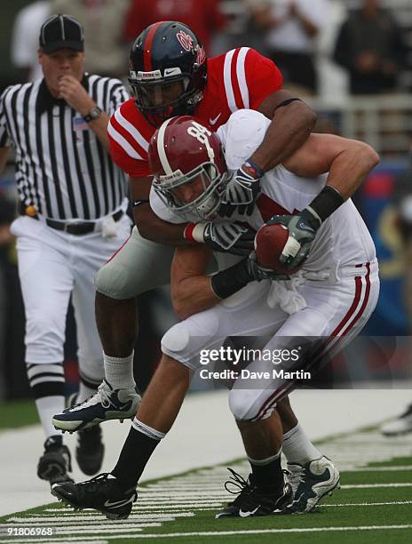 Tight End Colin Peek of the Alabama Crimson Tide hauls in a pass during their game against the Mississippi Rebels at Vaught-Hemingway Stadium on...