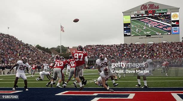 Linebacker Corey Reamer of the Alabama Crimson Tide blocks the kick of punter Tyler Campbell of the Mississippi Rebels game at Vaught-Hemingway...