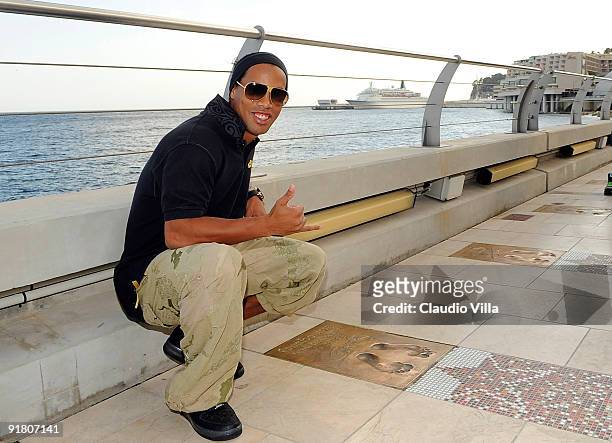 Ronaldinho, winner of the 2009 Golden Foot Award, poses for a photograph at the the Golden Foot Promenade at Monte Carlo on October 12, 2009 in...