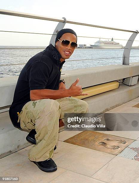 Ronaldinho, winner of the 2009 Golden Foot Award, poses for a photograph at the the Golden Foot Promenade at Monte Carlo on October 12, 2009 in...