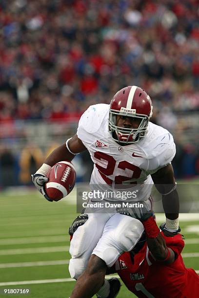 Mark Ingram of the Alabama Crimson Tide runs for yardage in their college football game against the Mississippi Rebels at Vaught-Hemingway Stadium on...