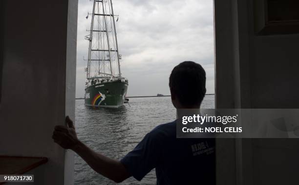 Greenpeace's iconic Rainbow Warrior sits anchored in Manila Bay during a visit on February 14, 2018. The Rainbow Warrior arrived in the Philippines...