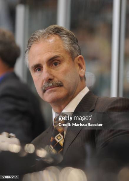 Head coach Willie Desjardins of the Medicine Hat Tigers stands on the bench against the Kelowna Rockets at Prospera Place on October 7, 2009 in...