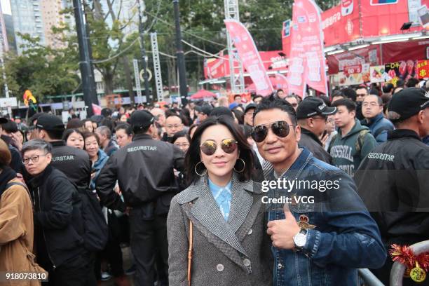 Actress Carina Lau and actor Simon Yam Tat-wah attend a promotional activity of director Patrick Kong's film 'A Beautiful Moment' at a new year...