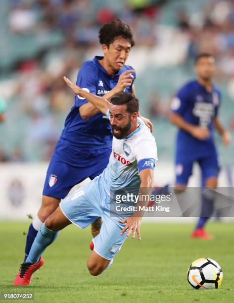 Alex Brosque of Sydney FC is challenged by Jo Sung-Jin of the Bluewings during the AFC Asian Champions League match between Sydney FC and Suwon...