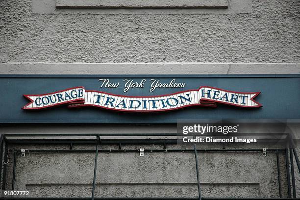 Detail view of the sign with the motto for the New York Yankees still hangs outside the original Yankee Stadium prior to an exhibition game on April...