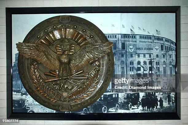 Replica of one of the original seals that adorned the entrances to the original Yankee Stadium hangs amongst an oversized image of first Opening Day...