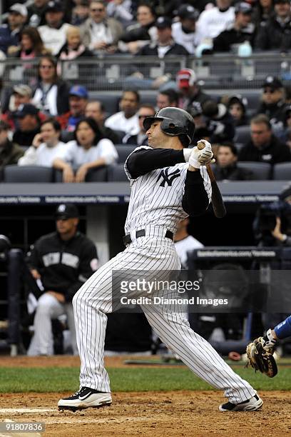 Outfielder Xavier Nady of the New York Yankees singles to centerfield during the bottom of the fifth inning of an exhibition game on April 4, 2009...