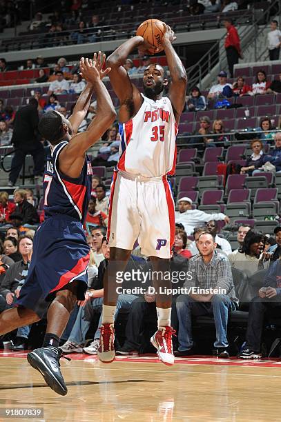 DaJuan Summers of the Detroit Pistons shoots a jump shot over Aaron Miles of the Atlanta Hawks during a preseason game at the Palace of Auburn Hills...
