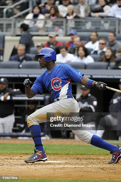 Outfielder Alfonso SOriano of the Chicago Cubs watches a ball he's just hit during a game on April 4, 2009 against the New York Yankees at Yankee...