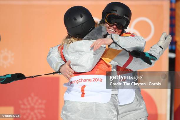 Gold medalist Chloe Kim of the United States is embraced by team mate and bronze medalist Arielle Gold of the United States during the Snowboard -...