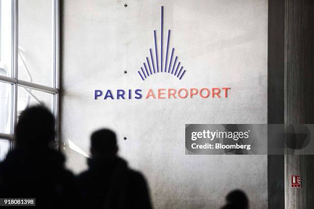 An Aeroports de Paris sign hangs on the wall inside Charles de Gaulle airport, operated by Aeroports de Paris, in Paris, France, on Monday, Feb. 12,...