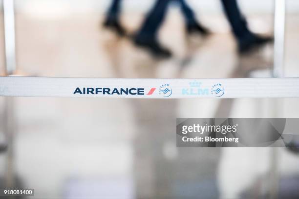 The Air France-KLM Group logo sits on a retractable belt barrier at Charles de Gaulle airport, operated by Aeroports de Paris, in Paris, France, on...