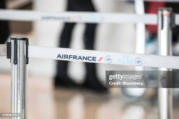 The Air France-KLM Group logo sits on a retractable belt barrier at Charles de Gaulle airport, operated by Aeroports de Paris, in Paris, France, on...